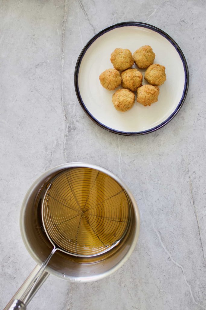 falafels being reheated by deep frying 683x1024 1